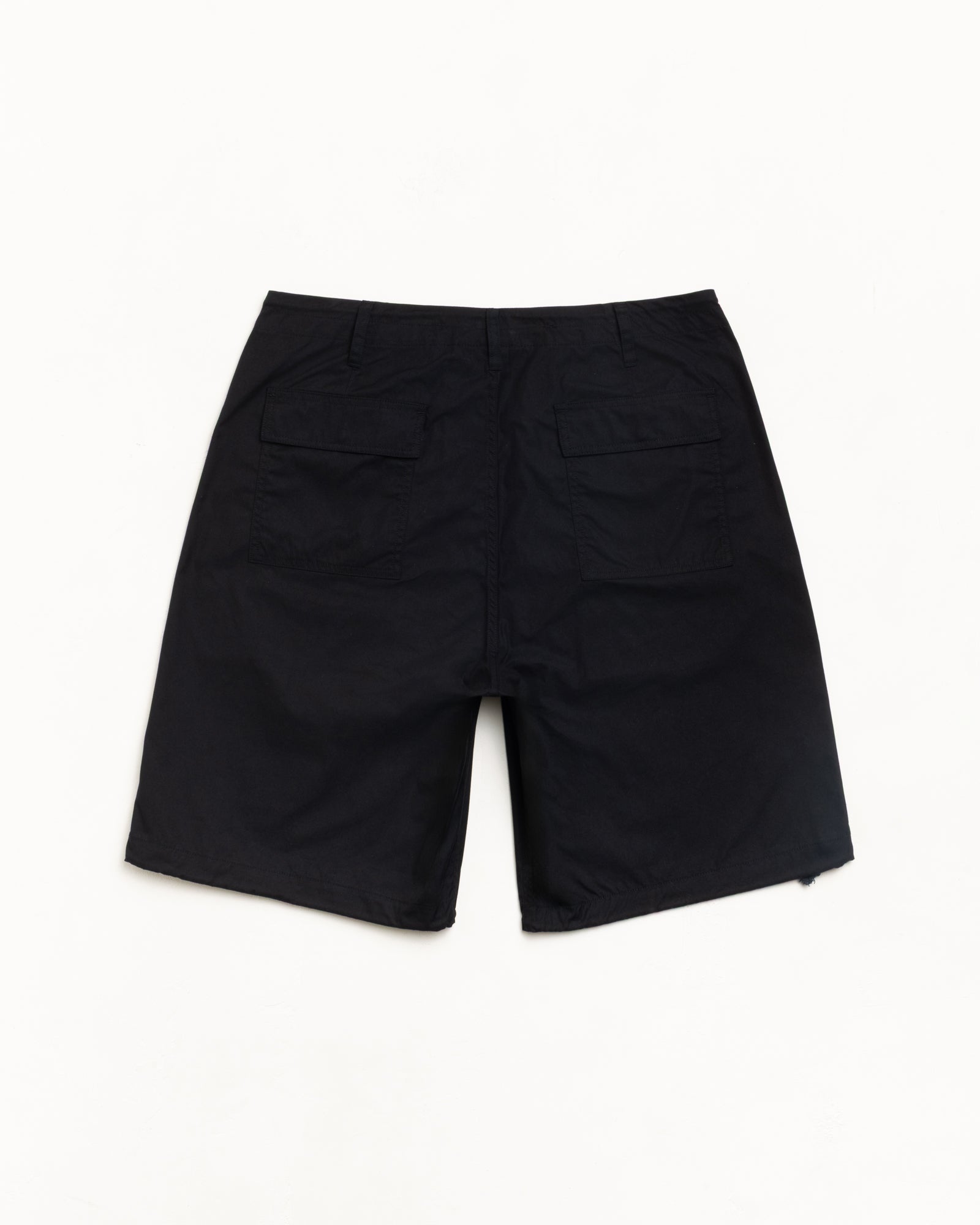 Black Surplus Short, back view with dual flap rear pockets, flat lay on white background