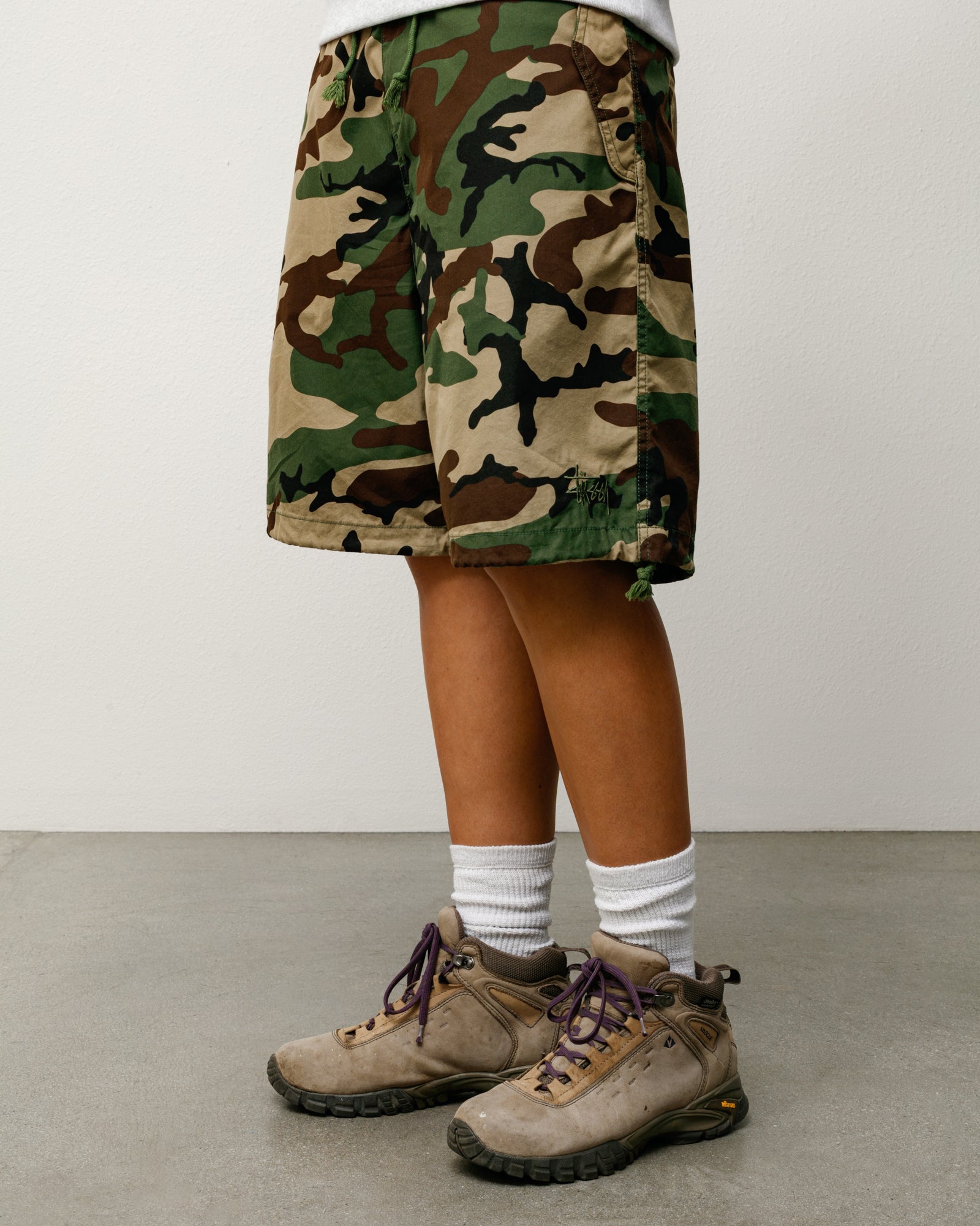 Woodland camo baggy, knee-length shorts with drawcord hem and subtle logo embroidery
