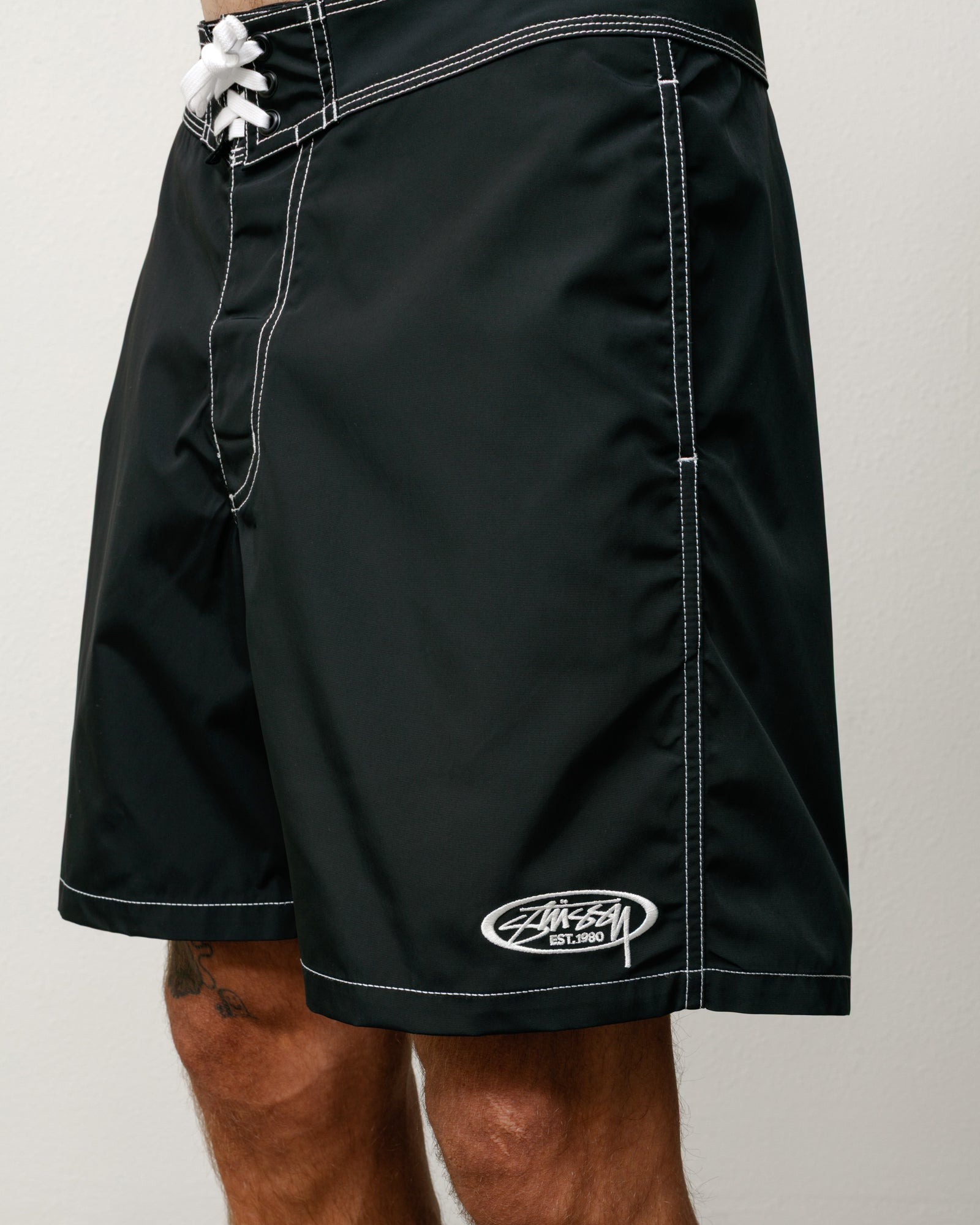 Coastal Board Short Unisex in black with white contrast stitching, lace-up waist, Stüssy logo