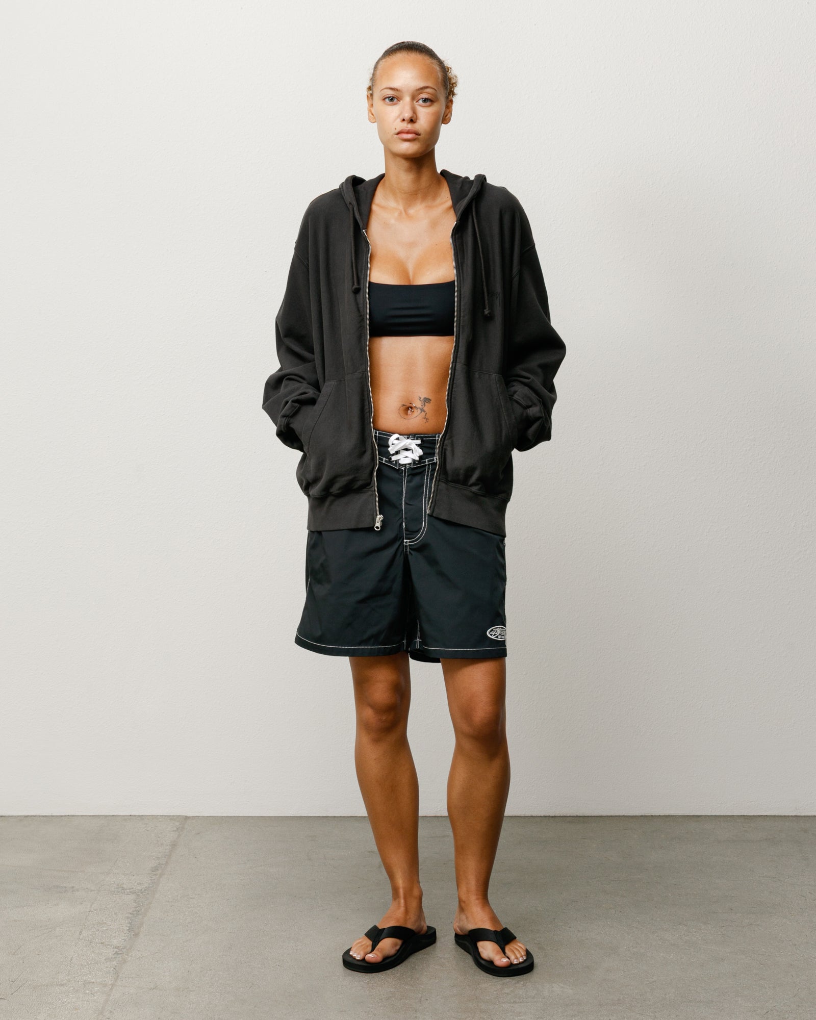 Coastal Board Short Unisex In Black Styled On Model With White Drawcord And Contrast Stitching