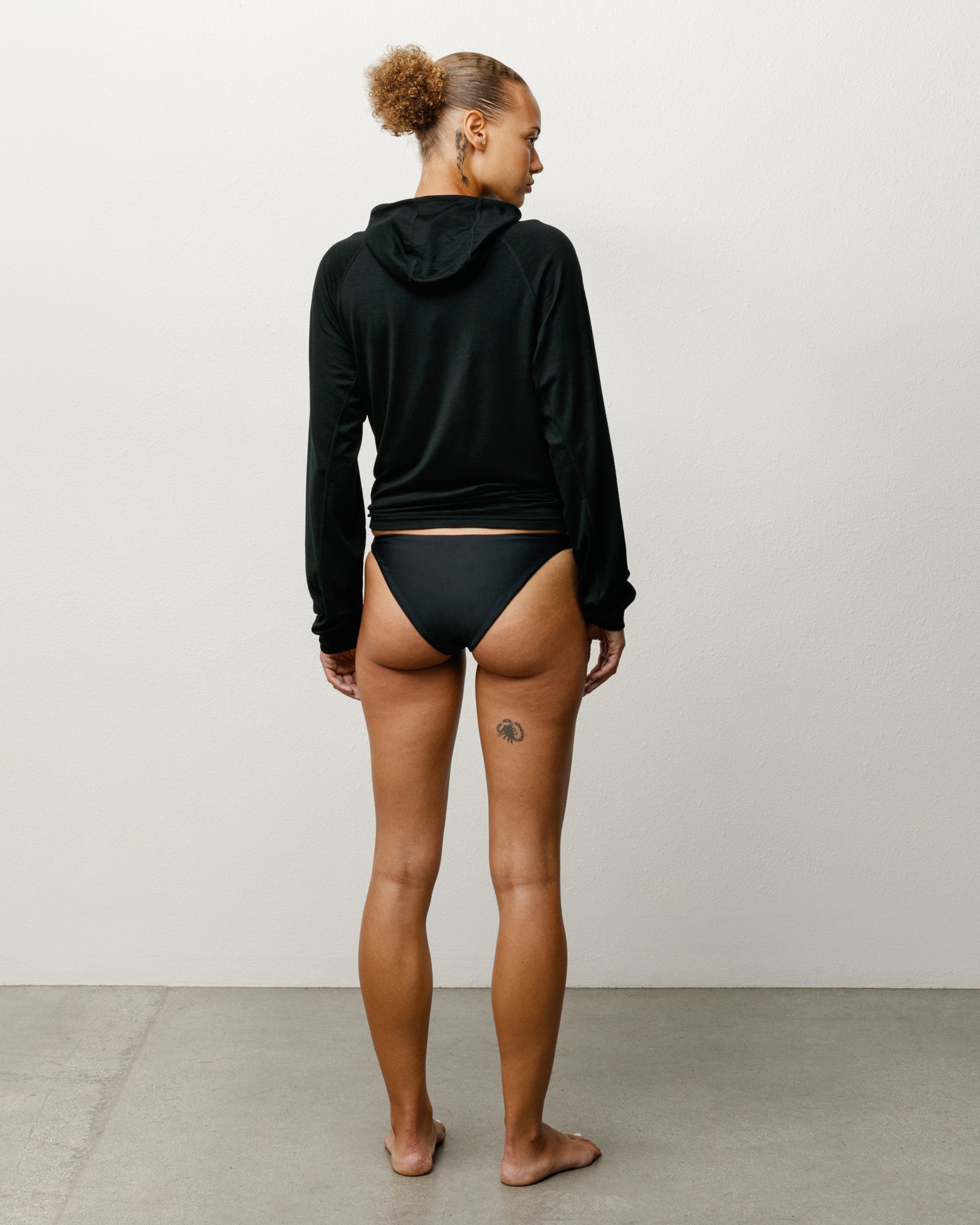 Bikini Bottom Womens Swim in the colour Black featuring a mid-rise waist and Stüssy branding.