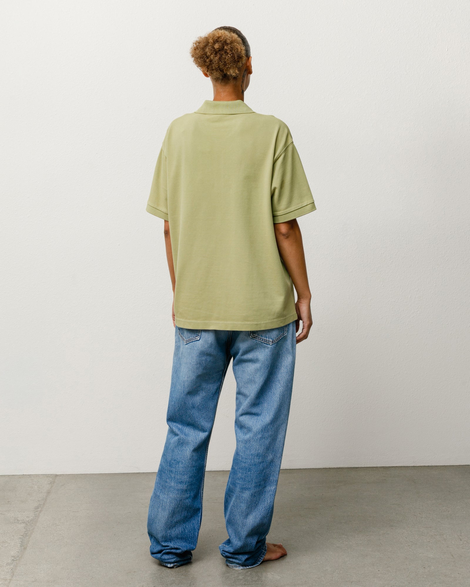 Classic Pique Polo Unisex Short Sleeve In Leaf, Back View On Model