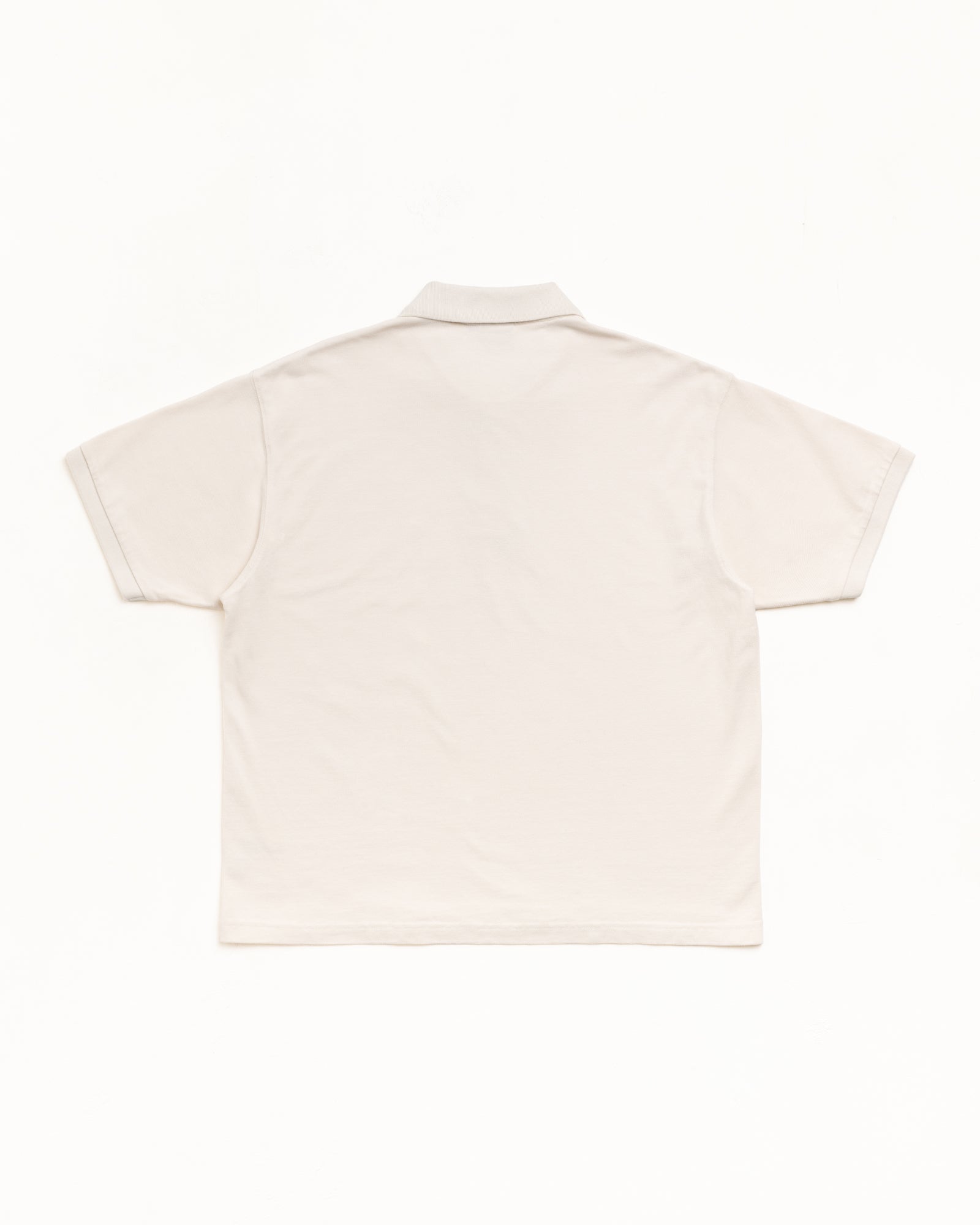 Classic Pique Polo Unisex Short Sleeve In Off White, Back Flat Lay; Rib Collar And Cuffs