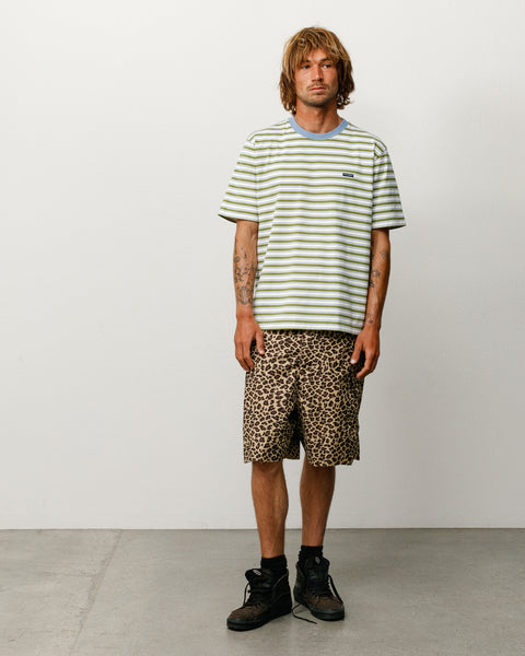 Green and white striped short-sleeve tee with blue ribbed crew collar, model front view