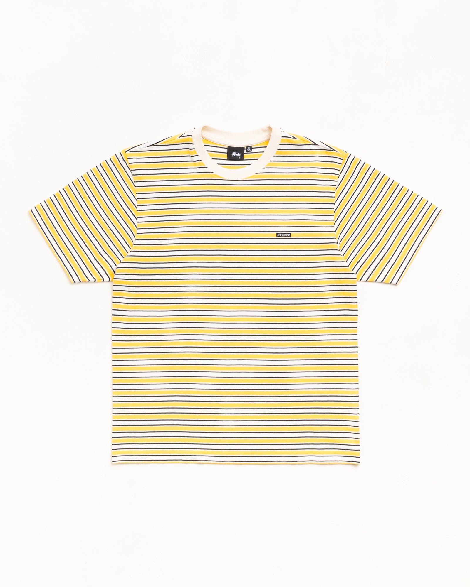 Yellow striped short sleeve tee with white rib crewneck and small chest patch label