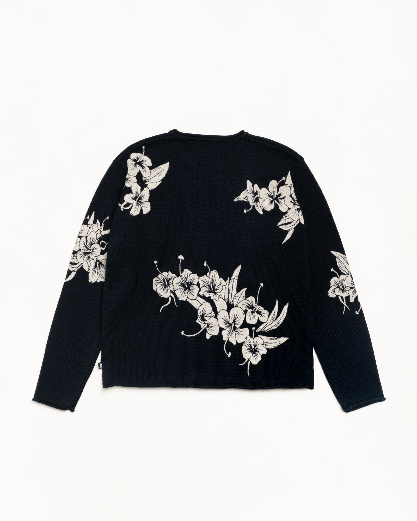 Black roll-neck sweater with white floral knit, long sleeves, back view