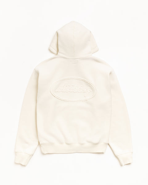 Natural zip hoodie, back view with tonal cursive applique logo and ribbed hem