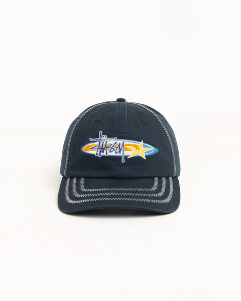 Black cotton low-profile six-panel cap with oval logo and star embroidery, contrast zig-zag stitching