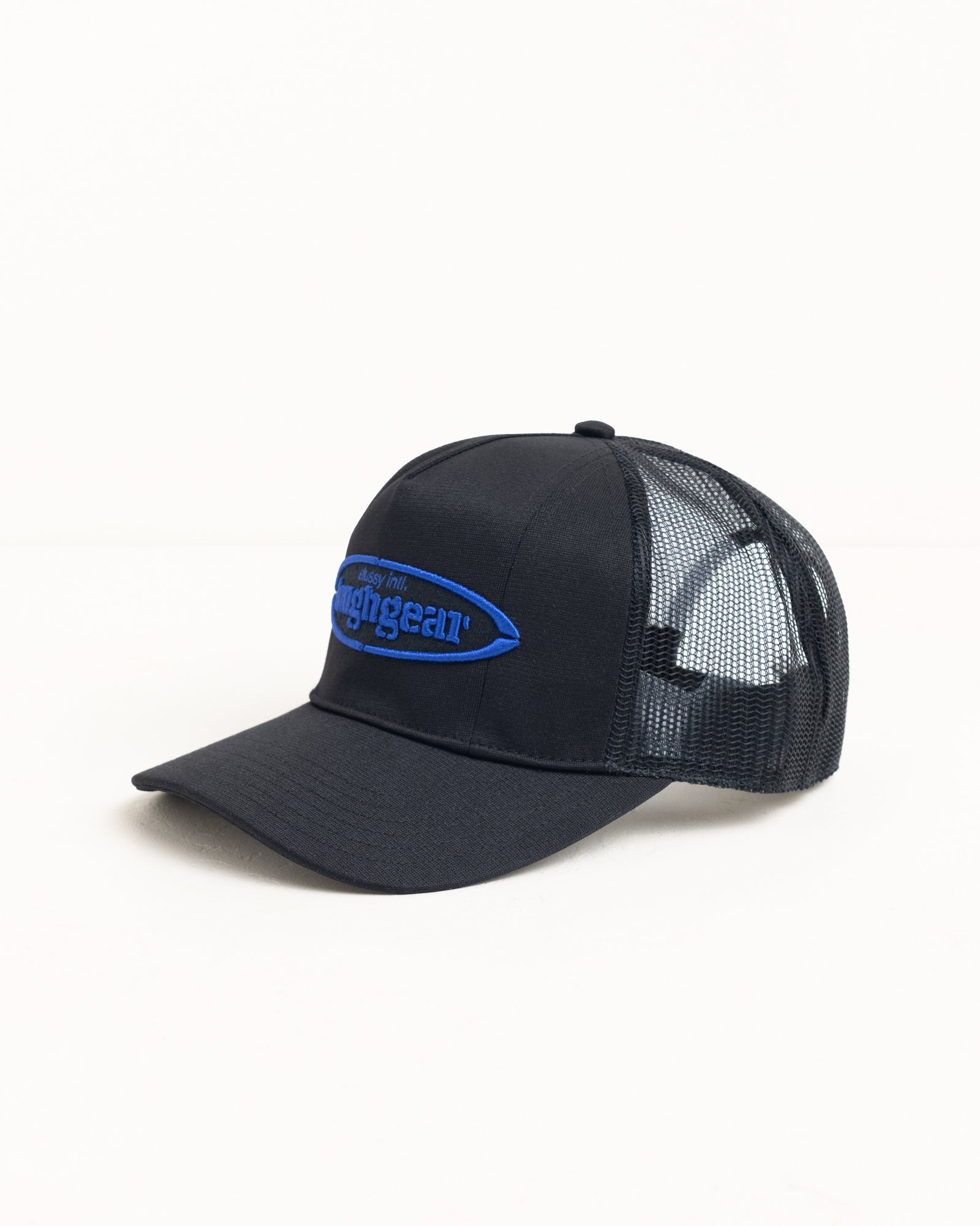 Black mesh trucker cap with curved brim and blue raised logo embroidery
