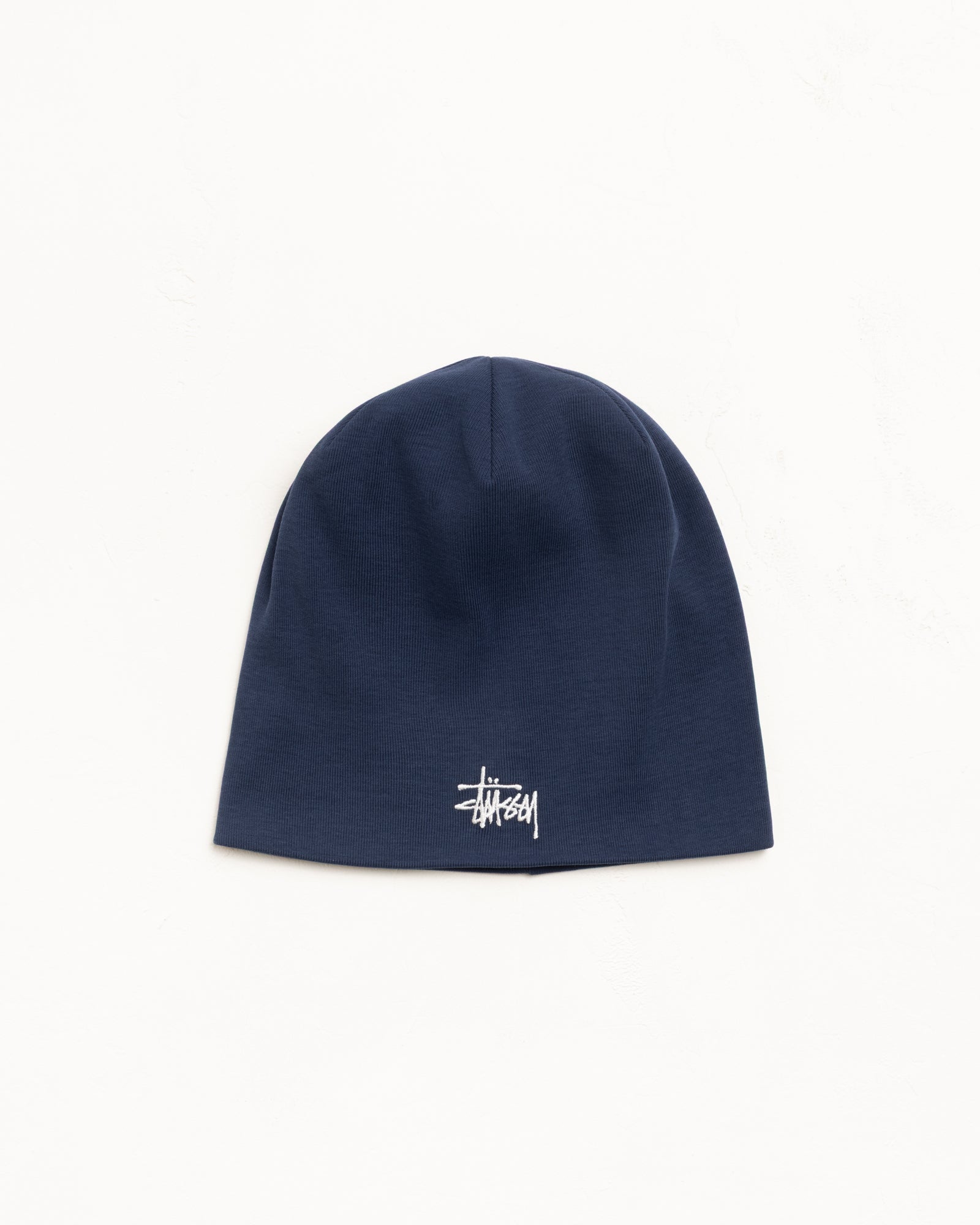 Navy jersey skullcap beanie with white embroidered logo