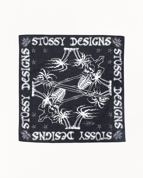 Black cotton bandana with white Stussy Designs border and mirrored skeleton surfer print