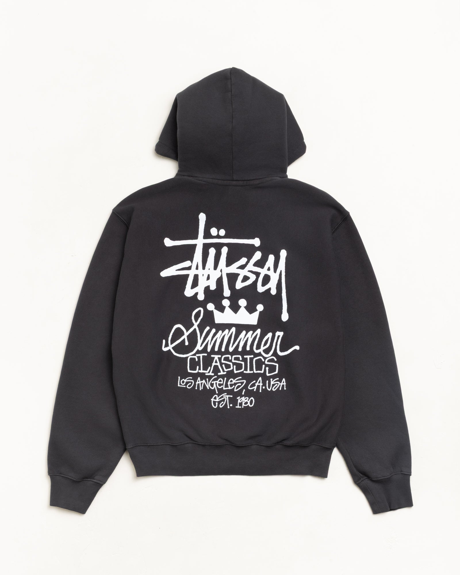 Garment-dyed unisex hoodie in faded black, long sleeve with bold white back graphic